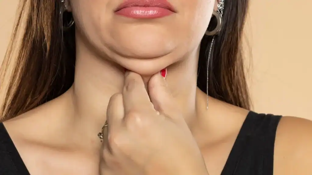 An image of a woman with double chin, sad, worried : Non Surgical Double Chin Removal Treatment in Kington, UK